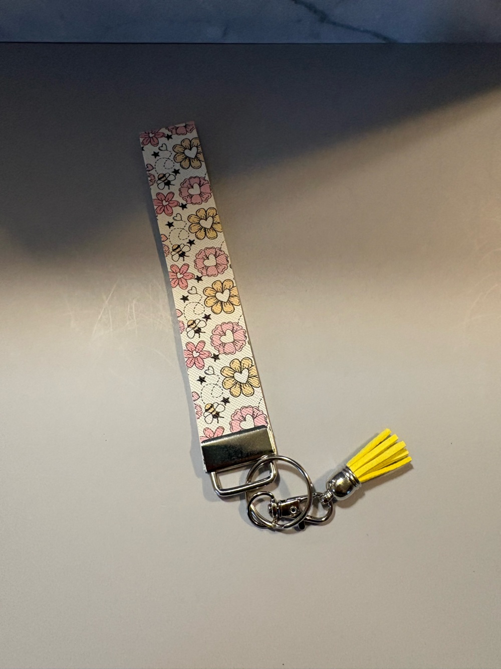 Floral Print Wristlet Keychain with Yellow Tassel